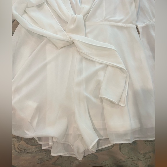 White Romper with Bell Sleeves, a Deep V Cut, and tie detailing - Picture 5 of 8